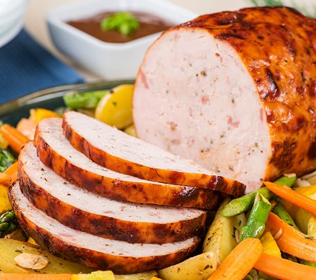 Enrollado a las finas hierbas con salsa de tamarindo picante